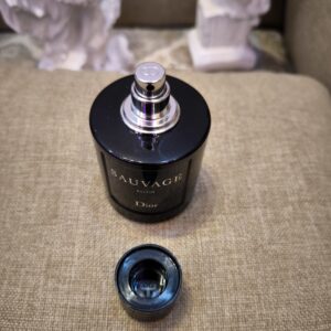 Dior Sauvage 100ml perfume bottle top view without cap with clean white background.