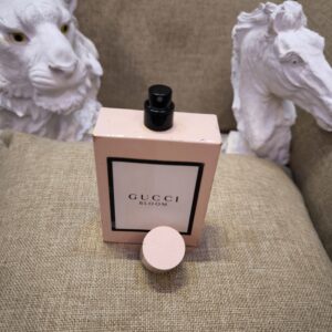 Gucci Bloom Pink perfume bottle without cap front view against white background.
